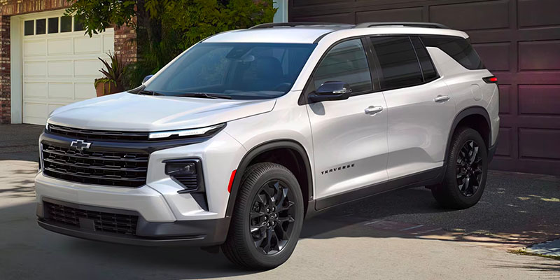 A white 2025 Chevy Traverse backed into a driveway near Seminole, OK.